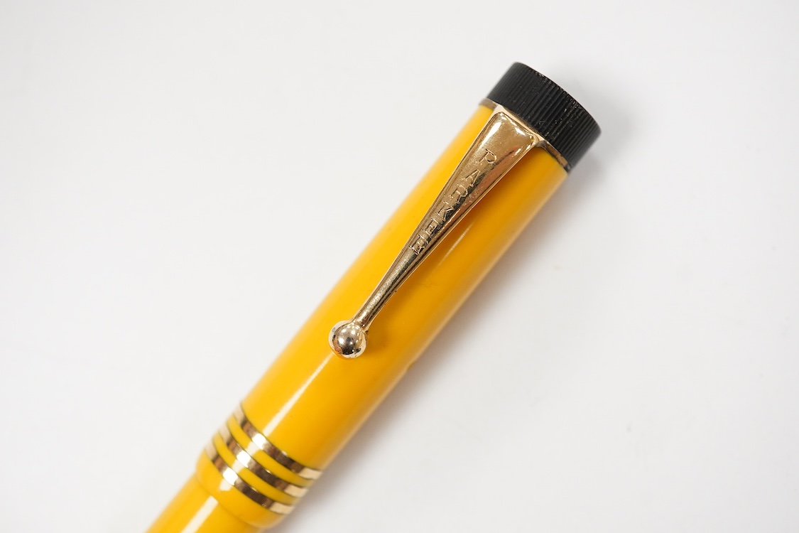 A Parker Lucky Curve Junionette in Mandarin yellow - mint pen but without barrel imprint which possibly left factory without one